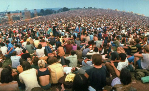 Wide-angle overall of huge crowd facing